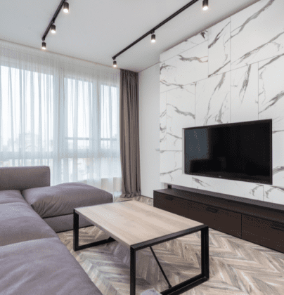 white and black accent wall with tv on it