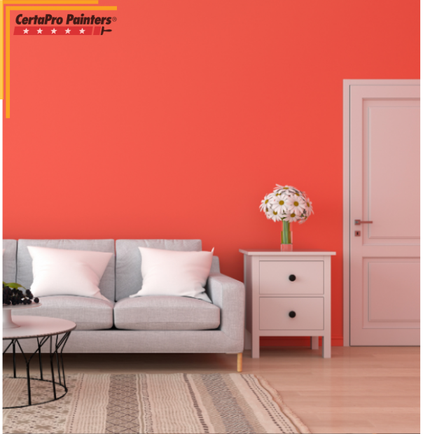 salmon painted room with couch and table