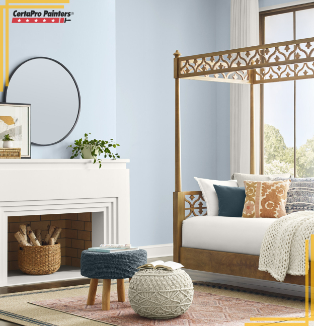 pale blue painted bedroom with daybed and fireplace