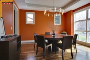 dining room with orange walls