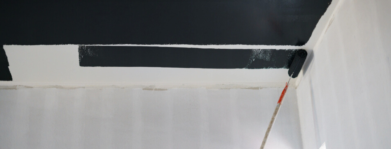 in progress photo of a ceiling with black ceiling paint
