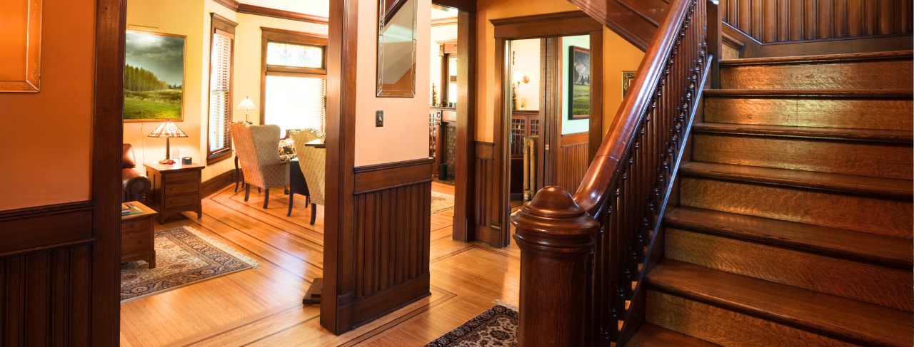 historic home with wood paneling and floors