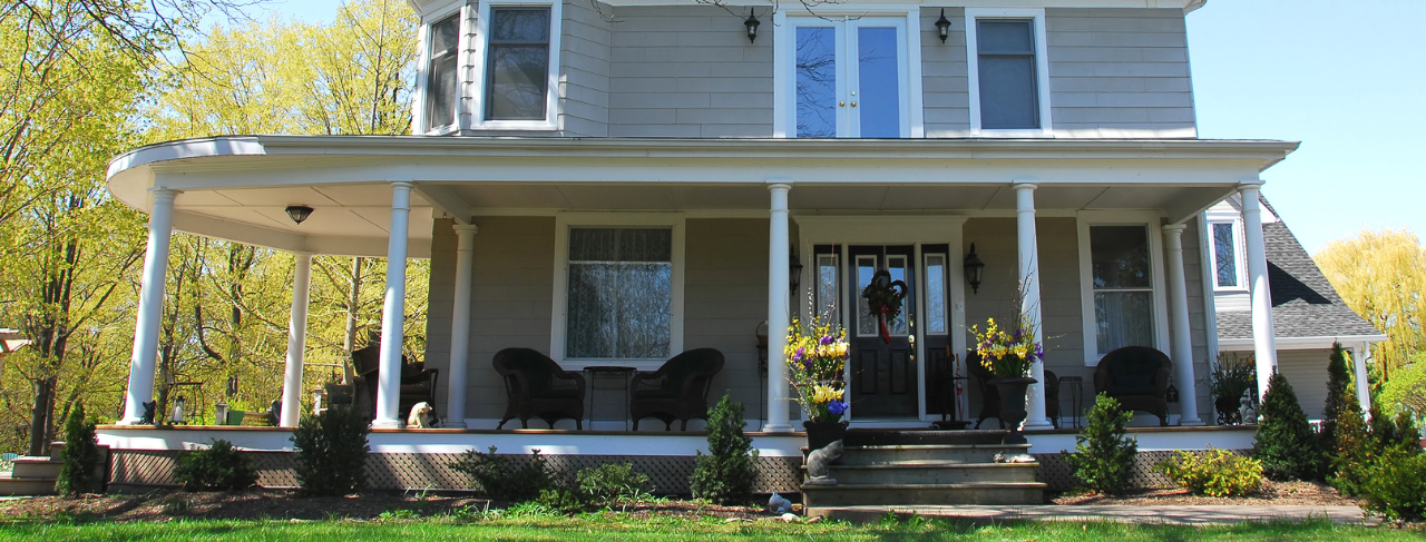 historic home with grey exterior and white trim