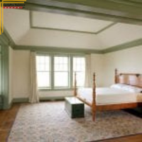 bedroom with white walls and green accent trim