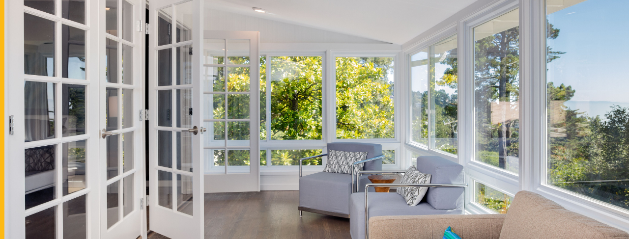 Sunroom with white painted walls