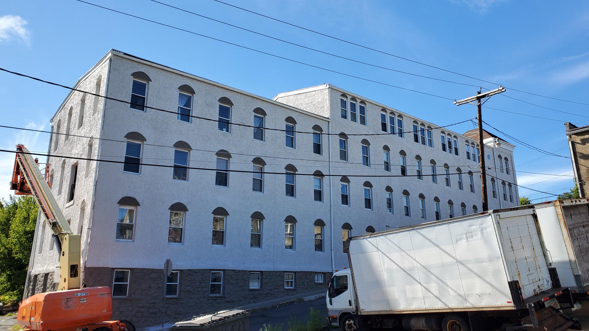 Front Angle of River Rock Management after completed commercial exterior painting project by CertaPro Painters of the Greater Lehigh Valley - Angle 2