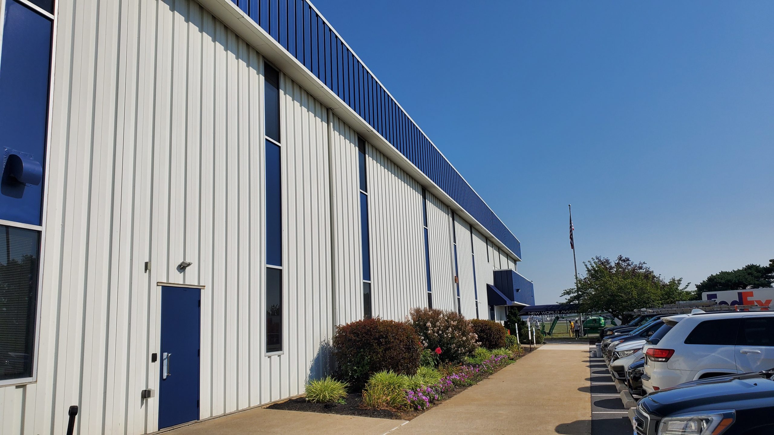 Front Angle of Completed commercial exterior painting project at New World Aviation in Allentown, PA, by CertaPro Painters of the Greater Lehigh Valley