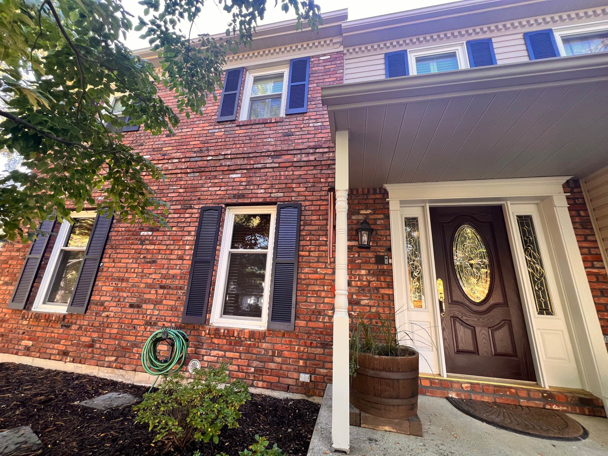 Front of house in Allentown, PA, after completed residential exterior painting project by CertaPro Painters of the Greater Lehigh Valley - Angle 2