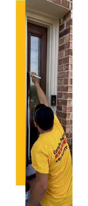 certapro employee painting door