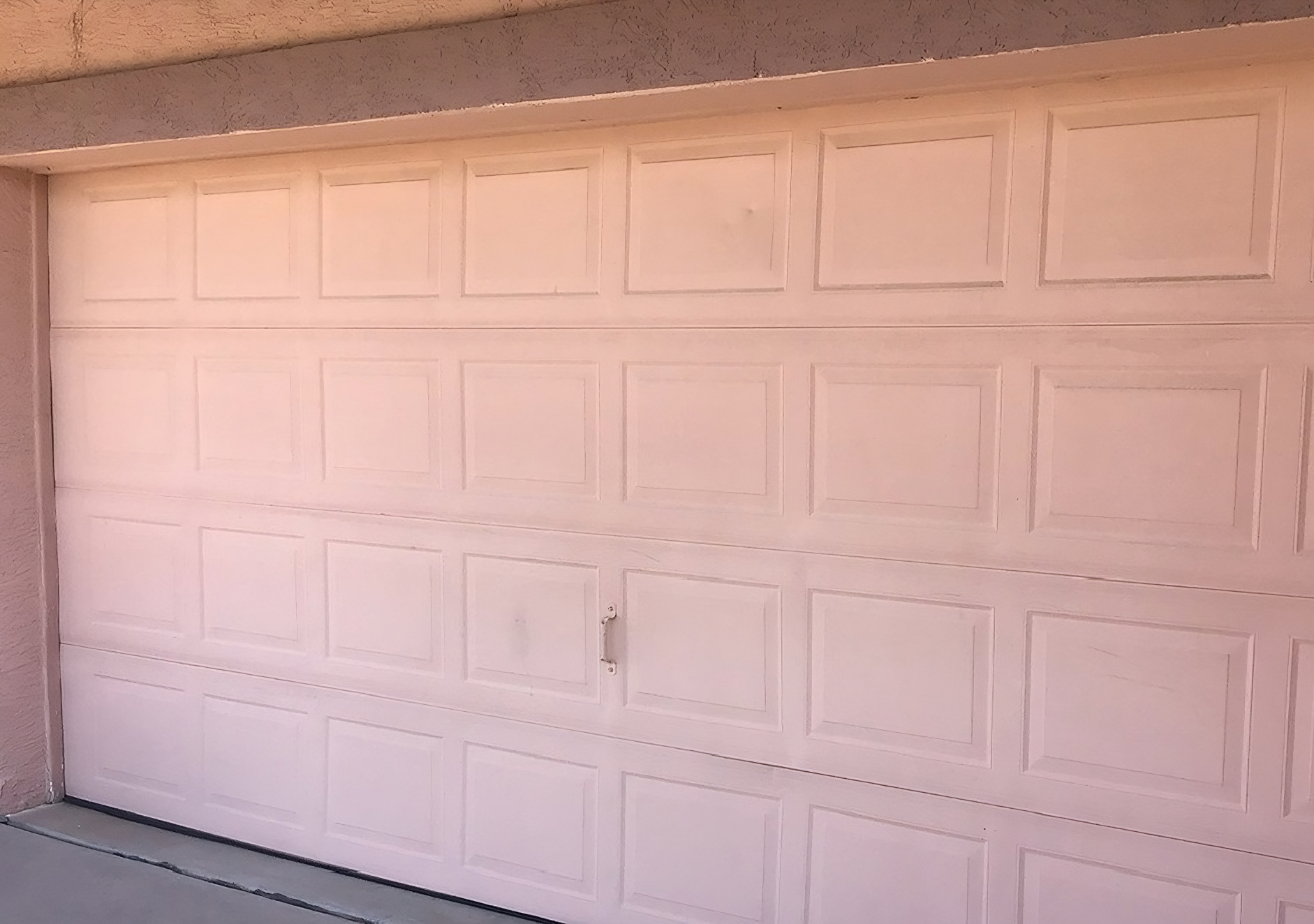 Peach Garage Door Repainted Blue Before