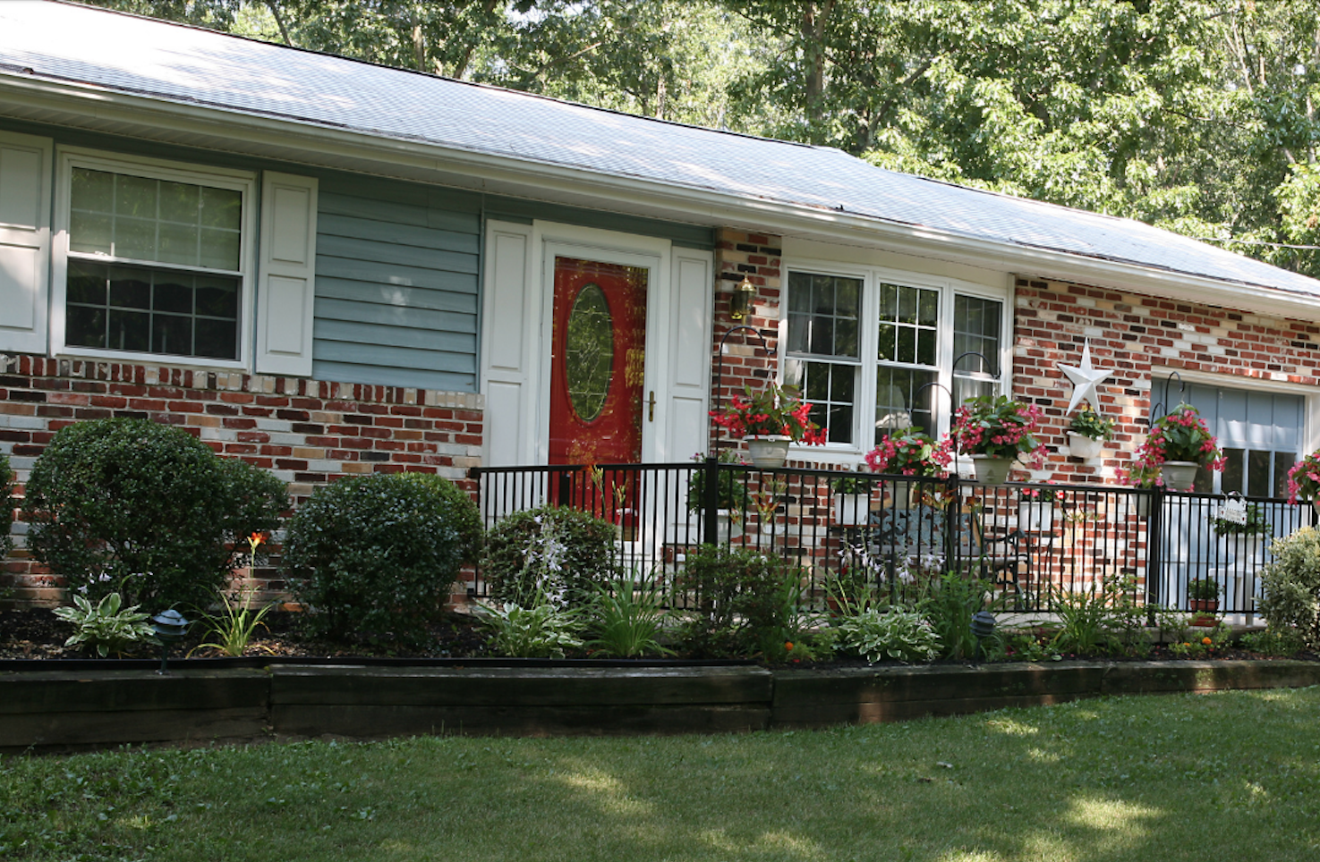Blue ranch home with brick