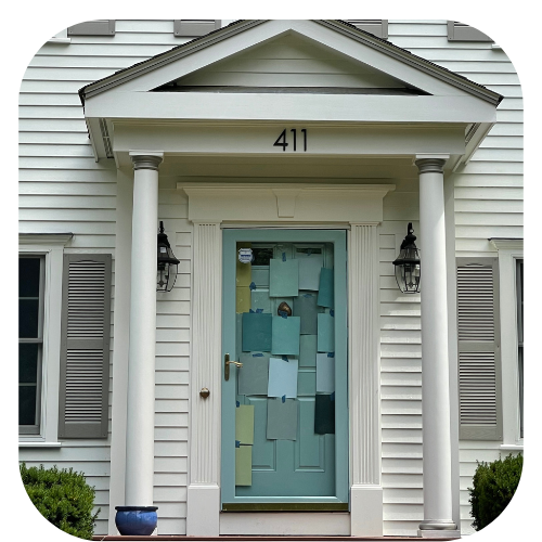 Front door peppered with tons of large paint color samples