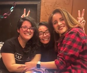 three women hugging