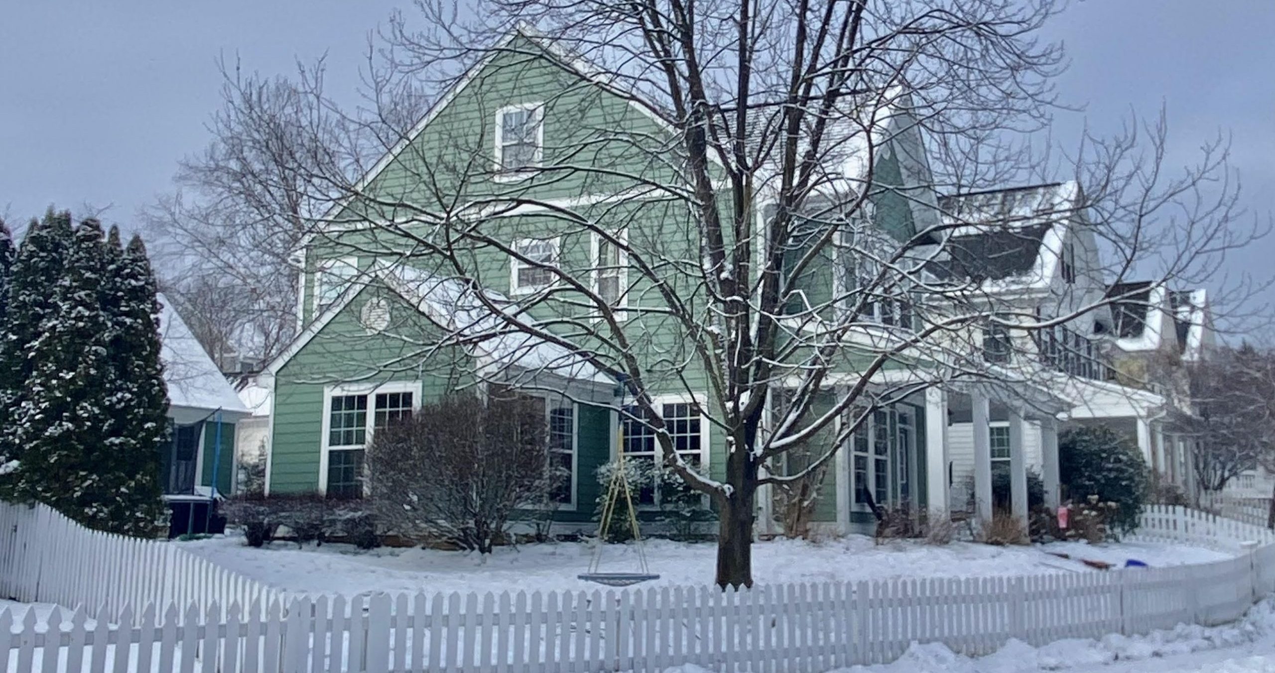 home wiht blue siding in the winter in charlottesville