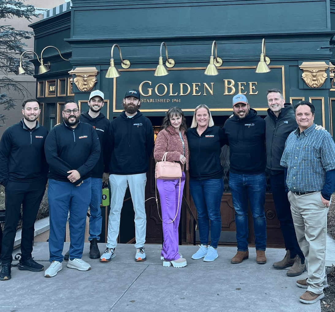 group of people outside restaurant entrance