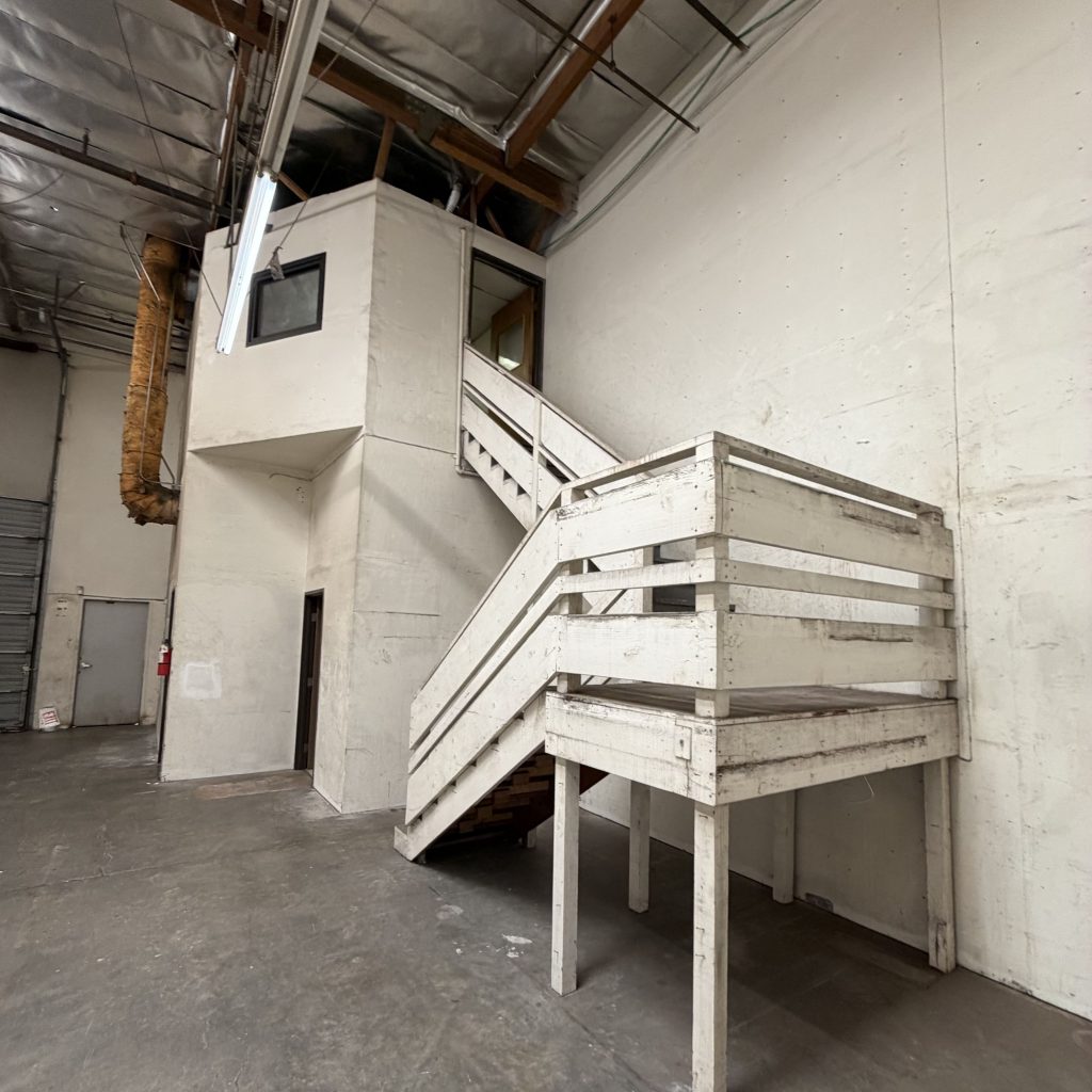 warehouse interior and staircase with aged paint