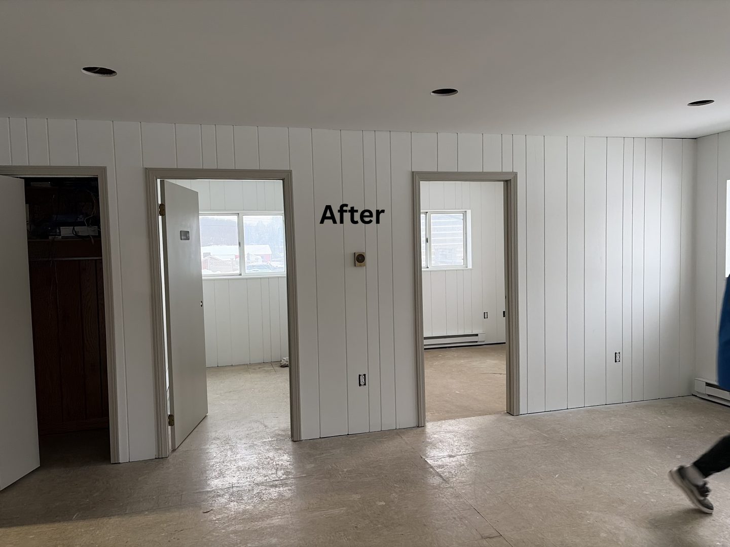 white painted interior wood paneled wall