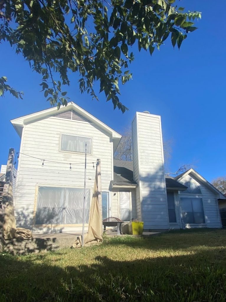 house exterior with white siding before repaint