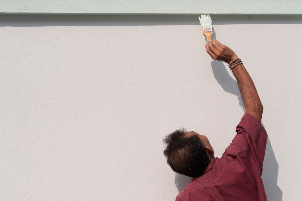 Man Painting Stucco