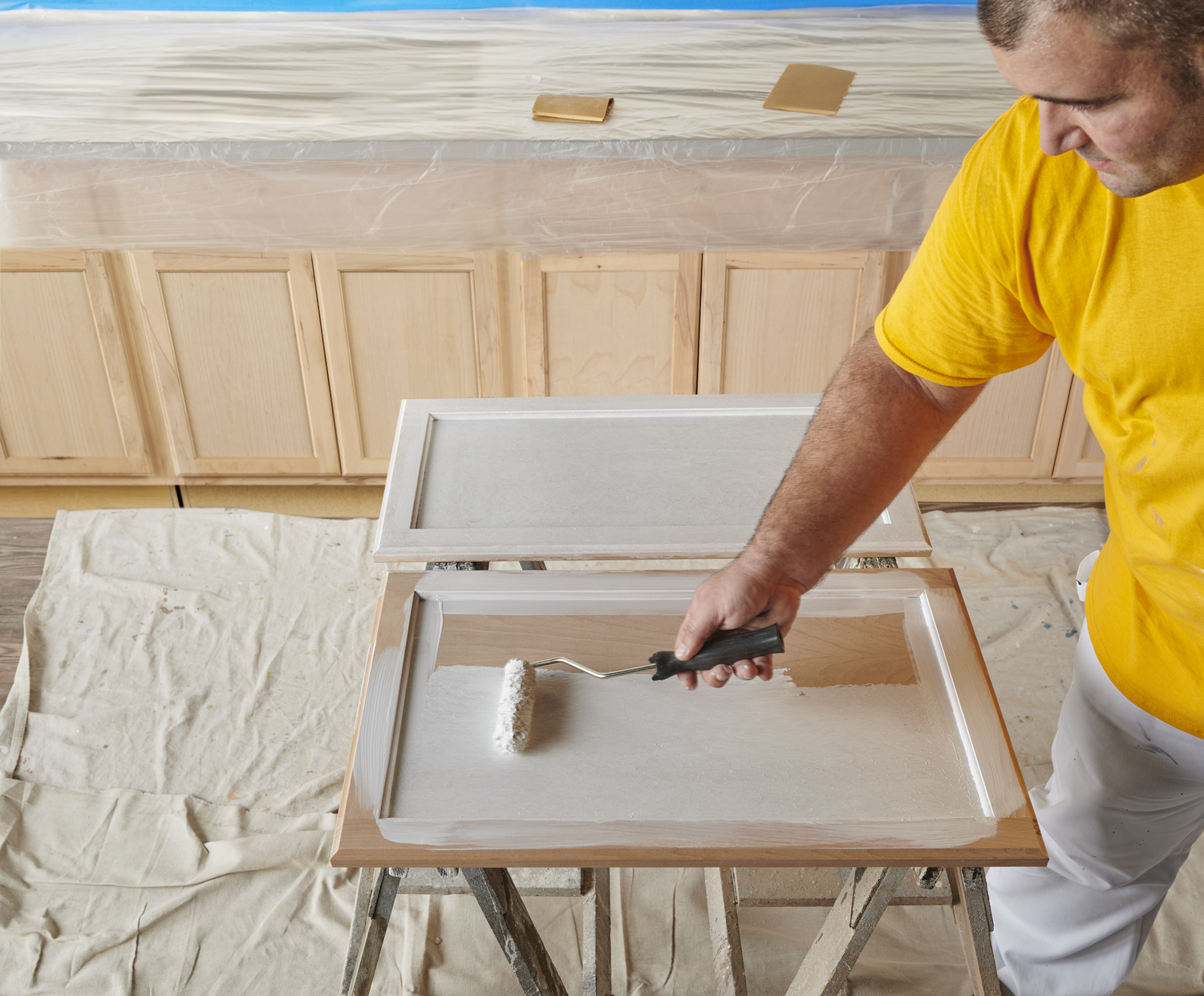 CertaPro priming kitchen cabinets