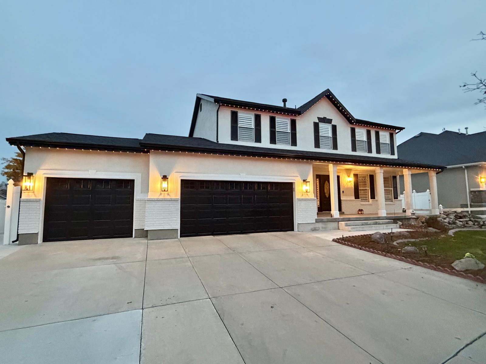 house exterior with white painted siding and black trim
