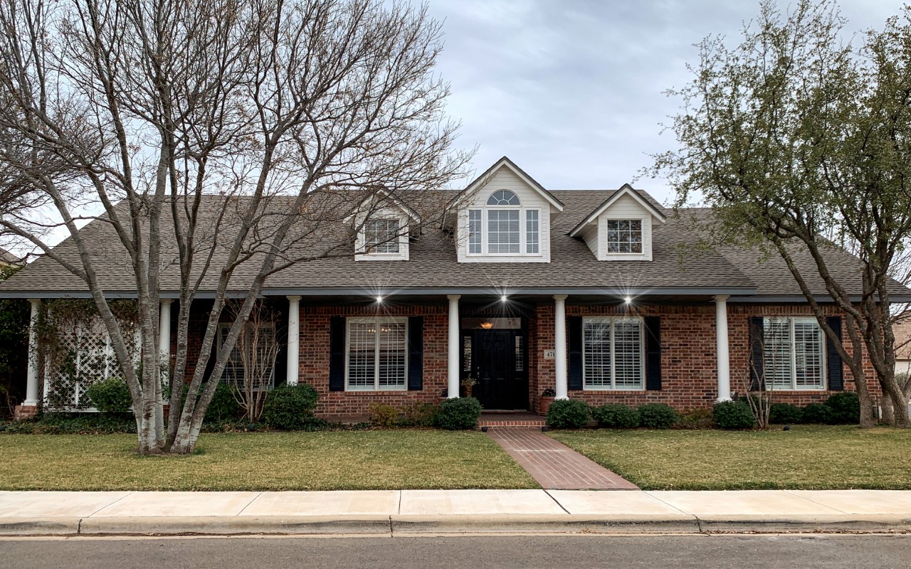 brick home with painted highlights