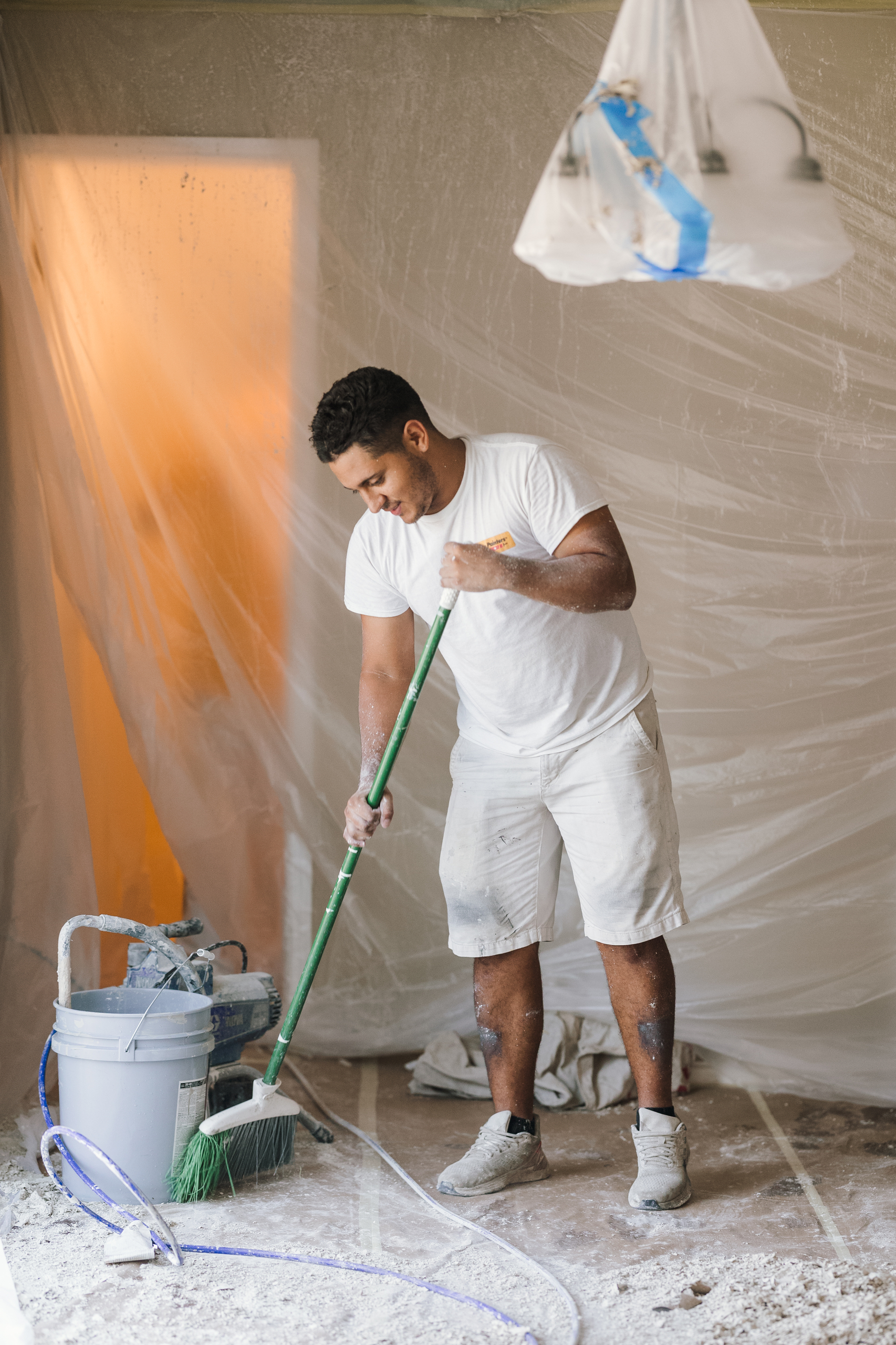 painter sweeping up