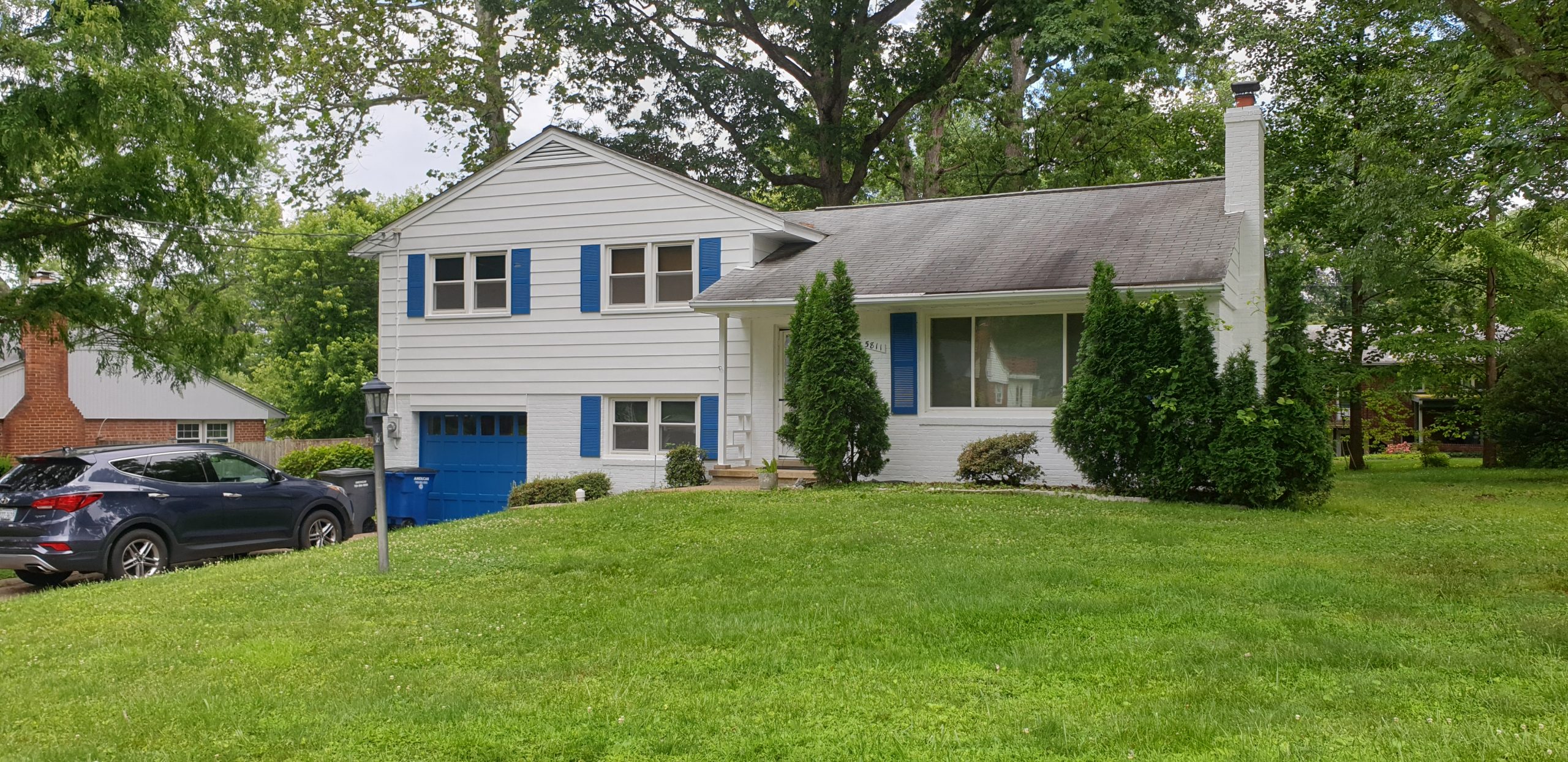 white siding with blue shutters home in springfield