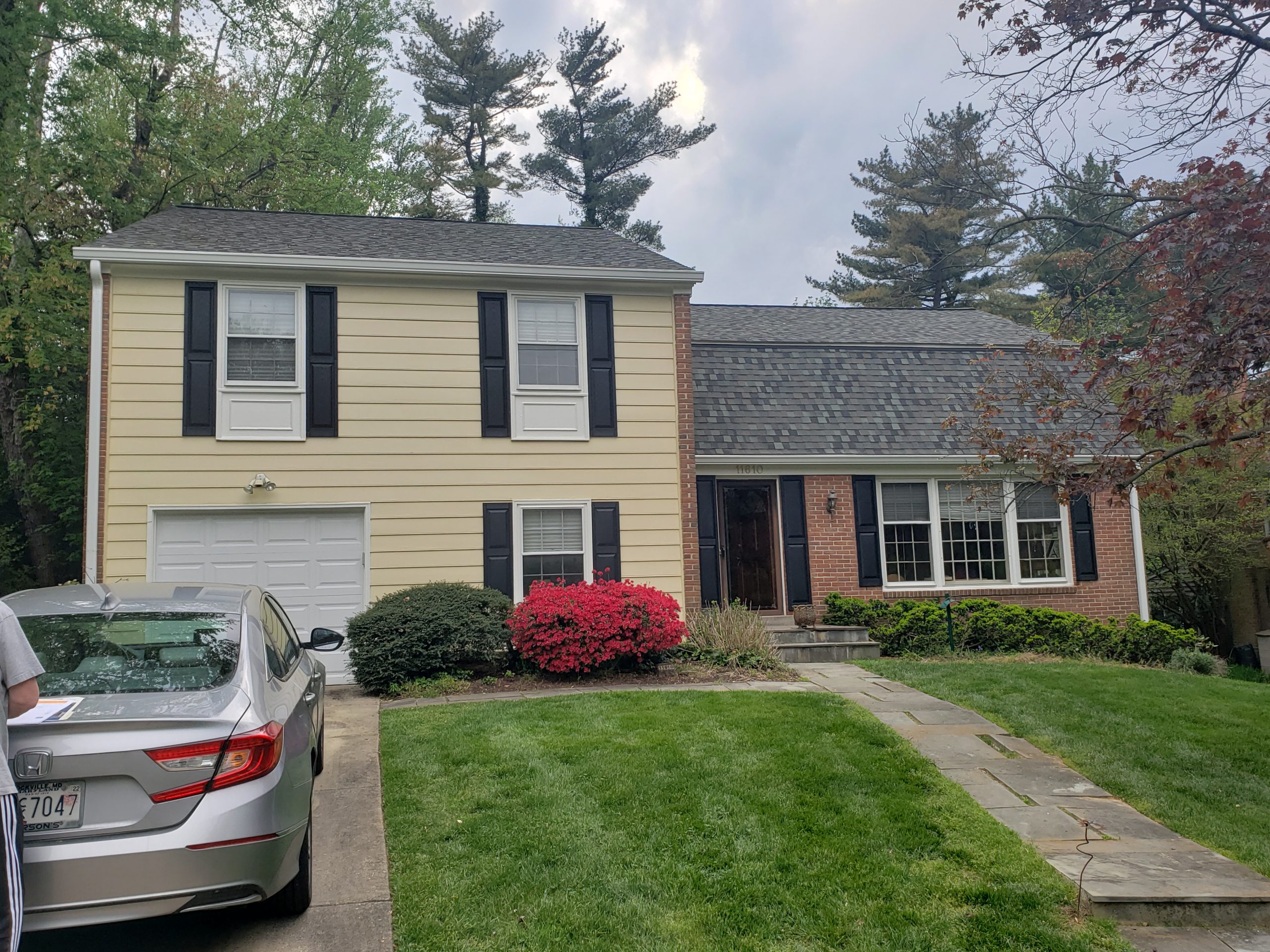 yellow siding and brick home