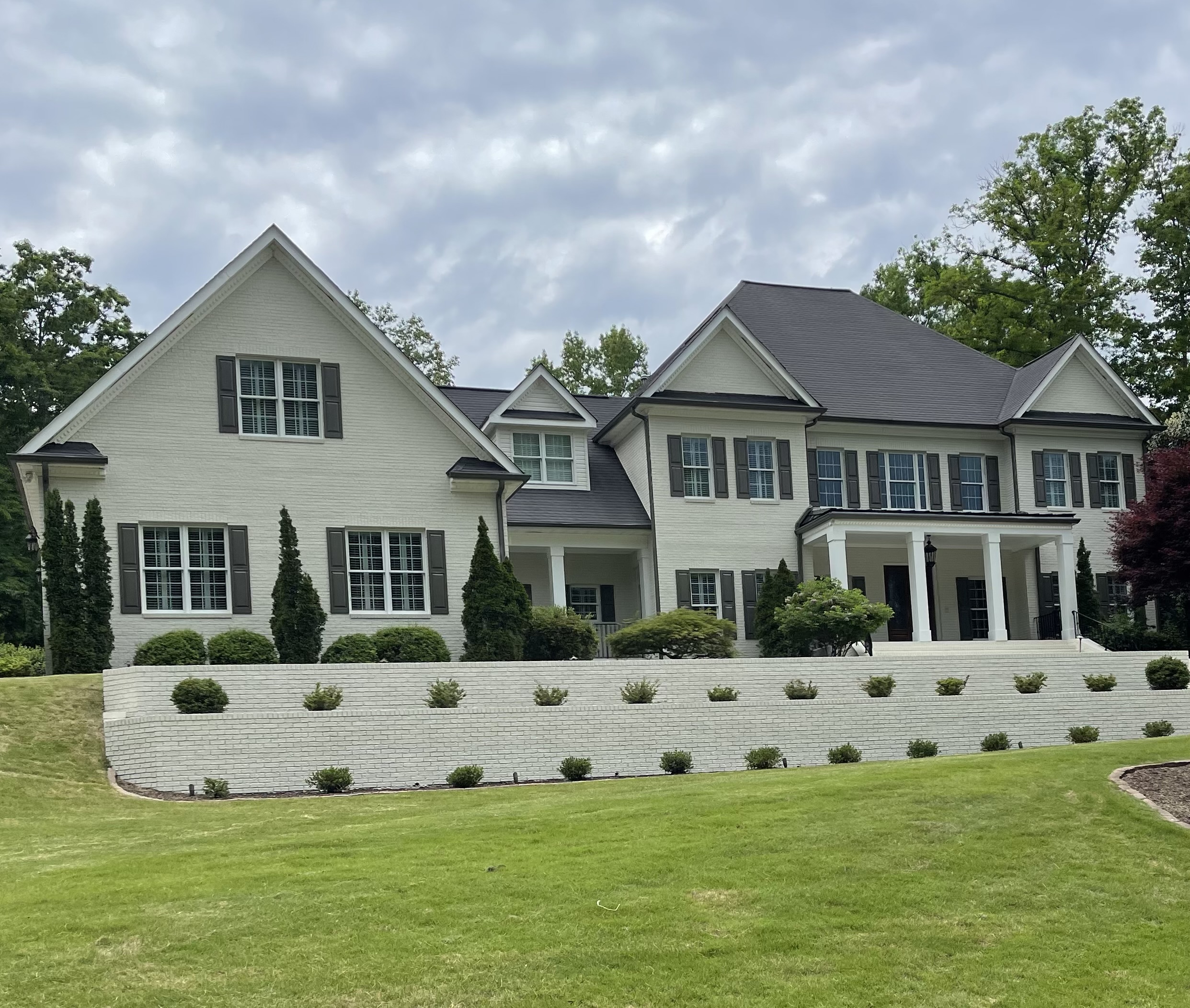 masonry house after exterior painted white