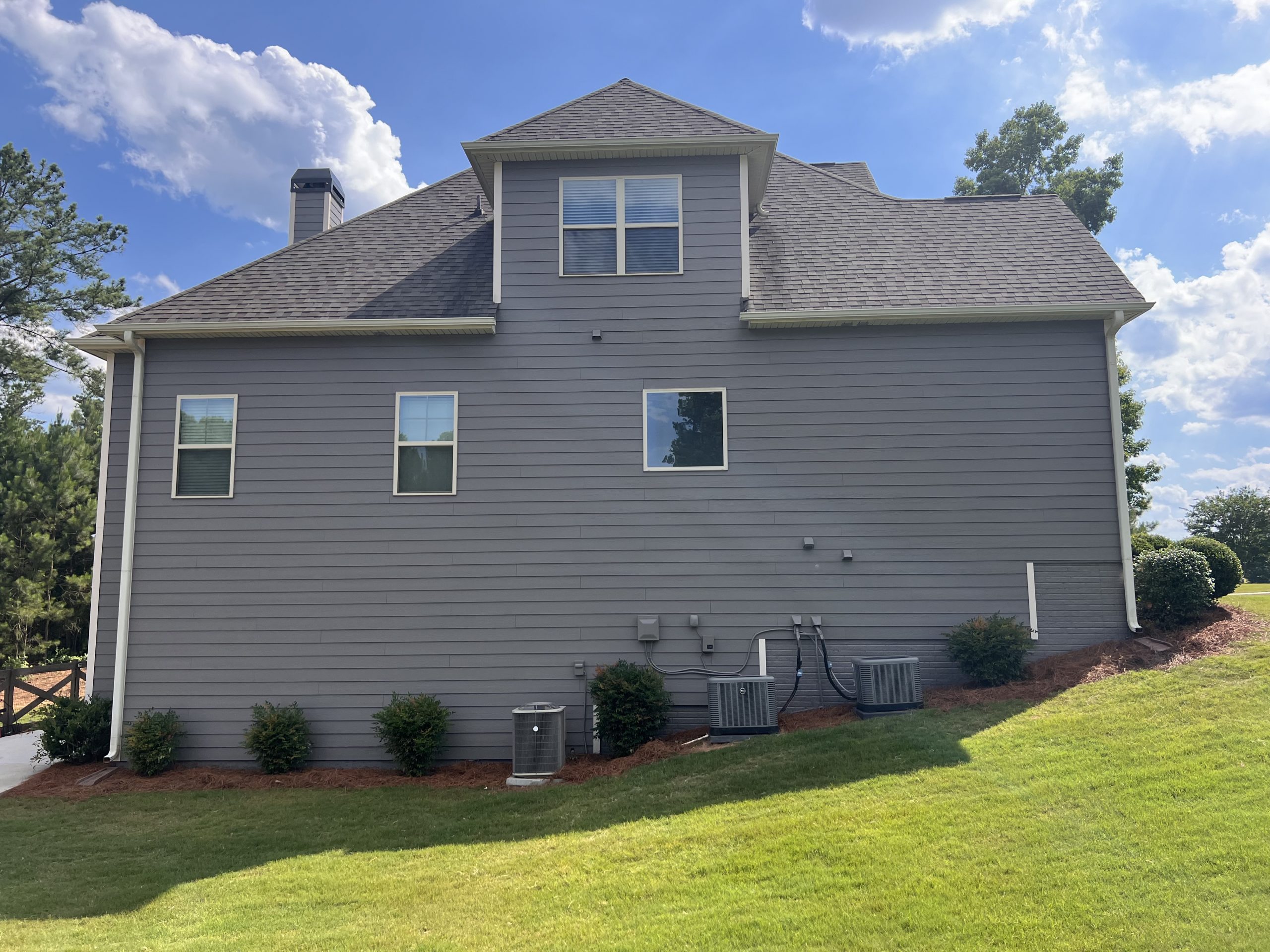 Back of gray home in Senoia after painting project