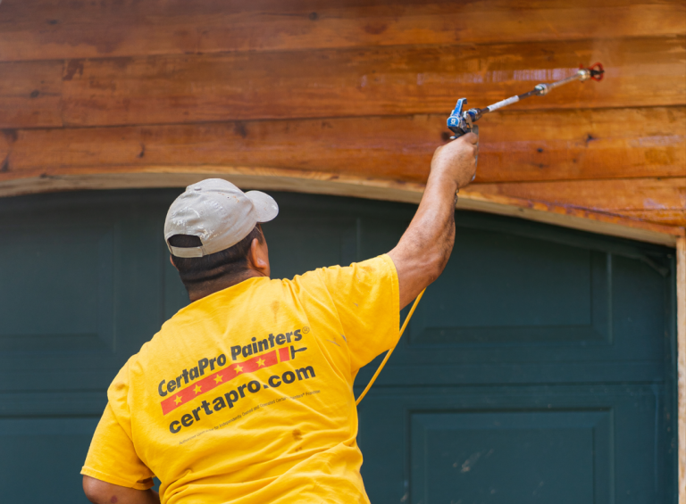 Exterior wood siding being painted