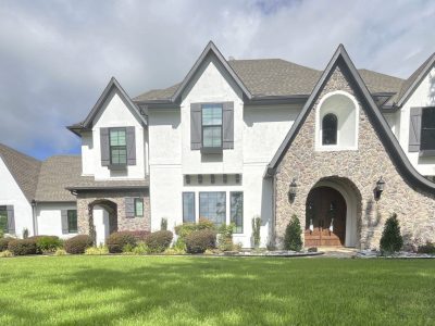 white painted stucco home exterior with grey accents