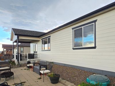 white painted house exterior with dark trim and accents