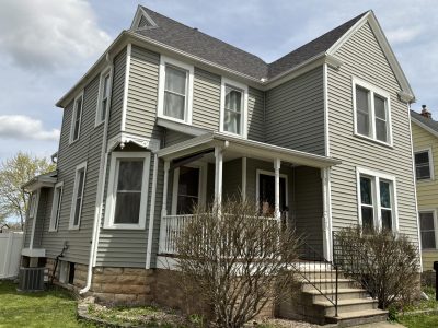 house with grey green painted siding