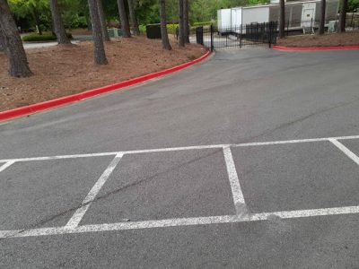 photo of repainted red fire lane curb in alpharetta
