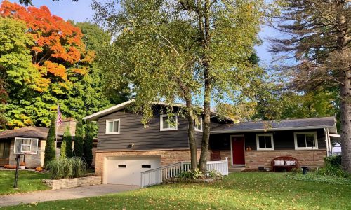 Brown Siding With White Trim