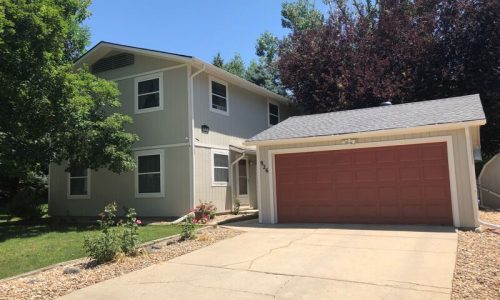 Sage Green Siding and Terracotta Garage Accent