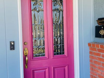 Front door of house painted light purple.