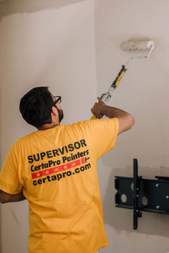 man painting wall