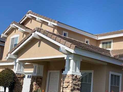 stucco house with trim painted white. Preview Image 1