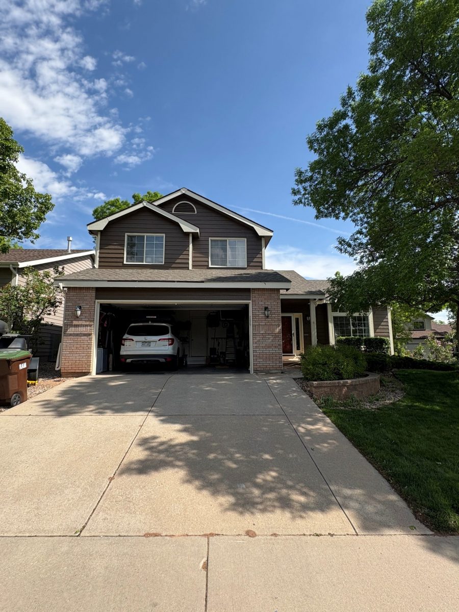 painted front of house with open garage door and driveway Preview Image 1