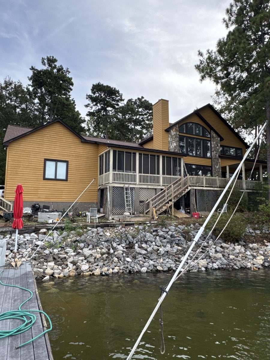 Rear elevation of a Dadeville lake house after exterior painting with fresh siding and dark-trimmed windows Preview Image 4