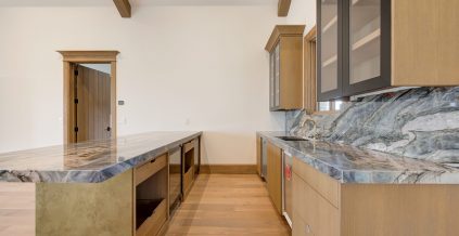 Brown Kitchen With Stone Countertops