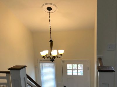 textured ceiling removal from a vaulted living room ceiling and a split level foyer ceiling