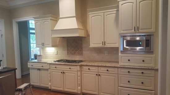 Kitchen with white cabinets repainted by CertaPro