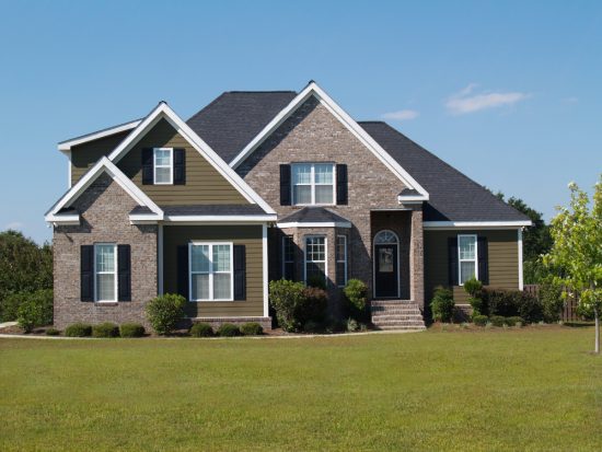 Front exterior of Oklahoma house painted with trim, shutters, and brick by CertaPro