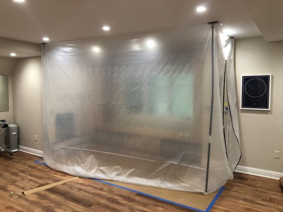 painting areas sealed off with plastic tarps