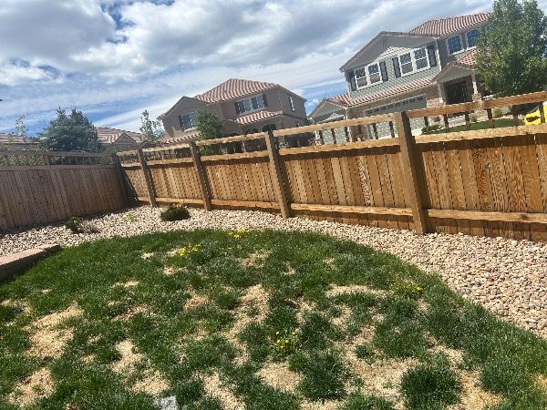 unpainted fence surrounding house Preview Image 5