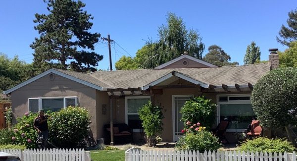 Full home shot with white fence